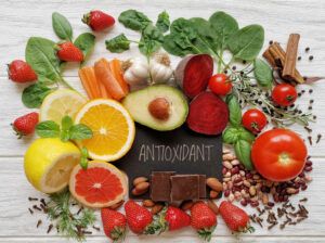 A collection of high antioxidant foods such as beets and strawberries with the word antioxidant written in the middle. 