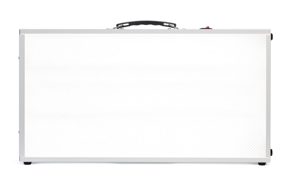 An Alaska Northern Lights large rectangular shaped white light therapy box with a black handle on the top.