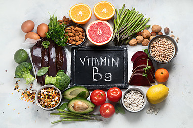 An assortment of high folate foods with vitamin B9 written in the middle.