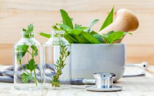 Herbs, a mortar & pestle, and a stethoscope.