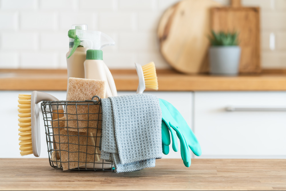 A caddy with natural cleaning products in it.