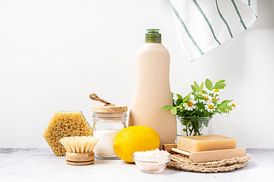 A collection of natural cleaning products with flowers.