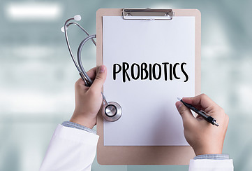 A doctor holding a clipboard that says probiotics.