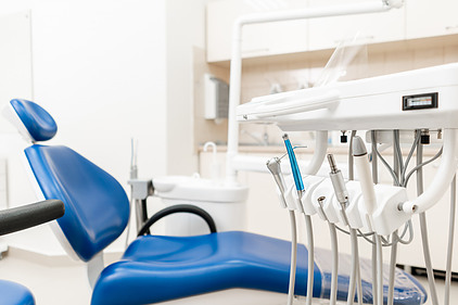 An exam chair in a dentist office.