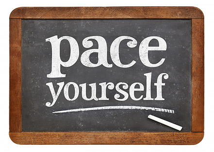 A chalkboard that says pace yourself.